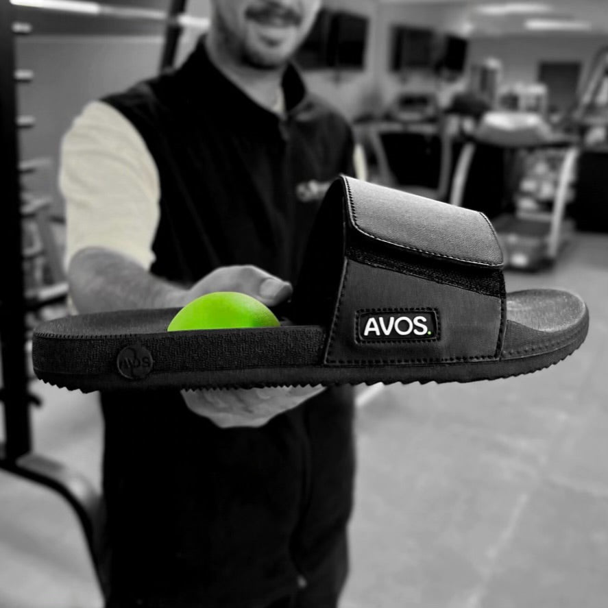AVOS Therapy Slide in the hands of a fitness professional